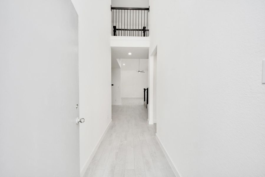 As you step into the threshold of this luxurious home, you'll soon be welcomed by an elegant glass door (to be installed). Inside, soaring ceilings amplify the spaciousness, while the refined wood-look tile flooring and oversized baseboards exude sophistication and charm. As you step into the threshold of this luxurious home, you'll soon be welcomed by an elegant glass door (to be installed). Inside, soaring ceilings amplify the spaciousness, while the refined wood-look tile flooring and oversized baseboards exude sophistication and charm.