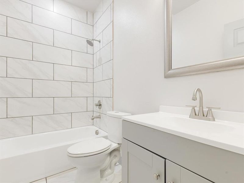 Full bathroom with vanity and shower / tub combination