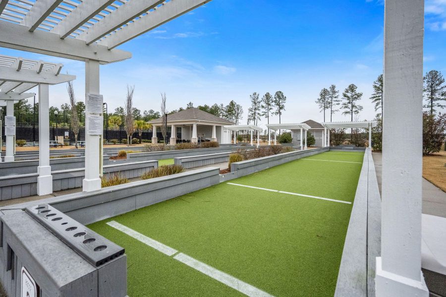 Exterior details and patio area of a home in K. Hovnanian's® Four Seasons at Lakes of Cane Bay, Summerville (Image 3).