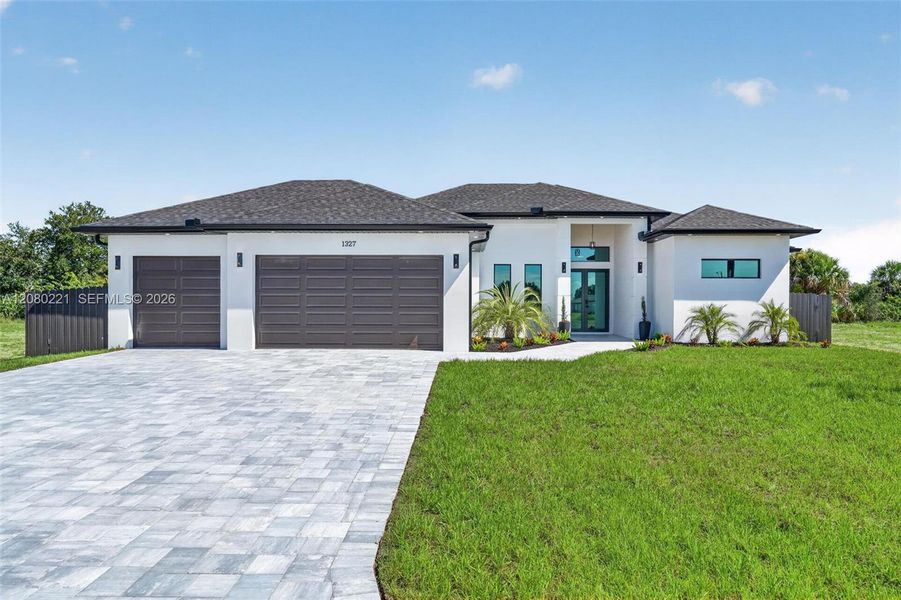 Front exterior of a new home in , Cape Coral, FL, highlighting curb appeal (Image 31).