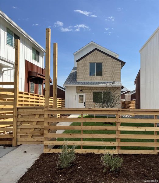 Front - Outdoor Space is Fenced, Landscaped w/Irrigation