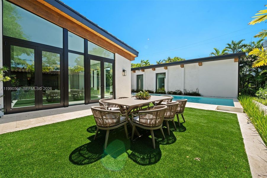 Exterior details and patio area of a home in , Coral Gables (Image 25).