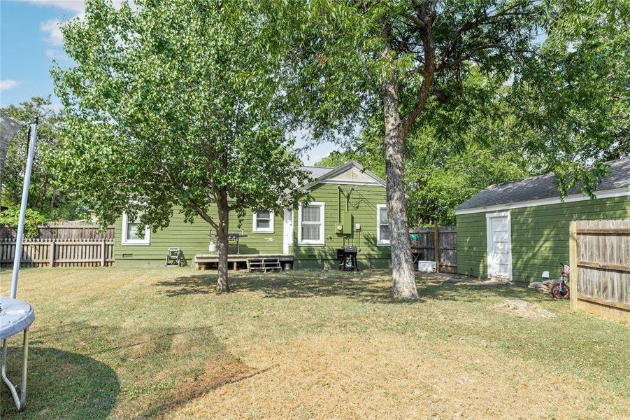 View of yard featuring a trampoline View of yard featuring a trampoline