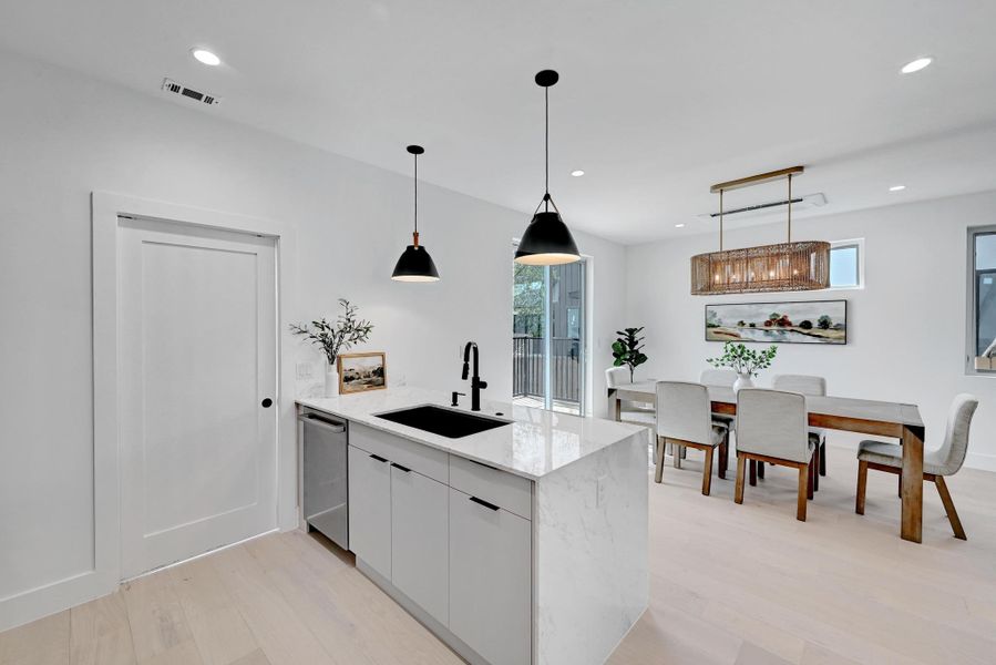 Kitchen opens to dining area