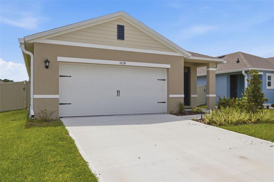 Front exterior of a new home in Concorde, Sanford, FL, highlighting curb appeal (Image 21). Front exterior of a new home in Concorde, Sanford, FL, highlighting curb appeal (Image 21).
