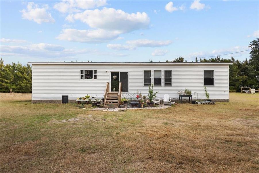 Exterior details and patio area of a home in , Bell (Image 11).