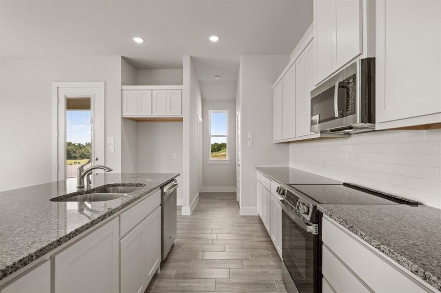 Furnished interior view inside a new home in Saddleback Estates, Boyd (Image 9). Furnished interior view inside a new home in Saddleback Estates, Boyd (Image 9).