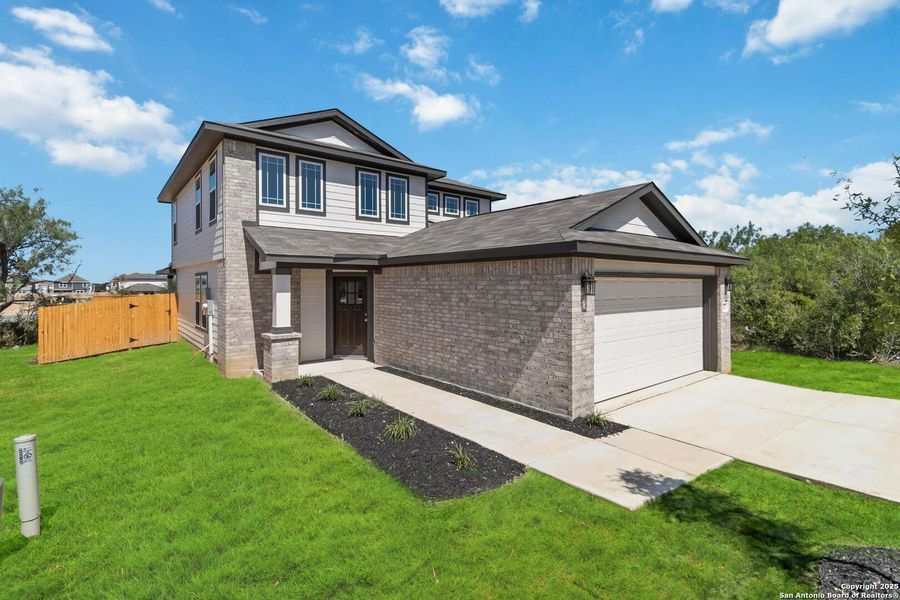 Front exterior of a new home in Applewhite Meadows, San Antonio, TX, highlighting curb appeal (Image 14).