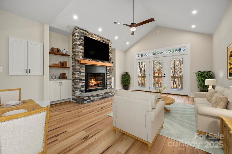 Great Room with vaulted ceilings. Virtually staged