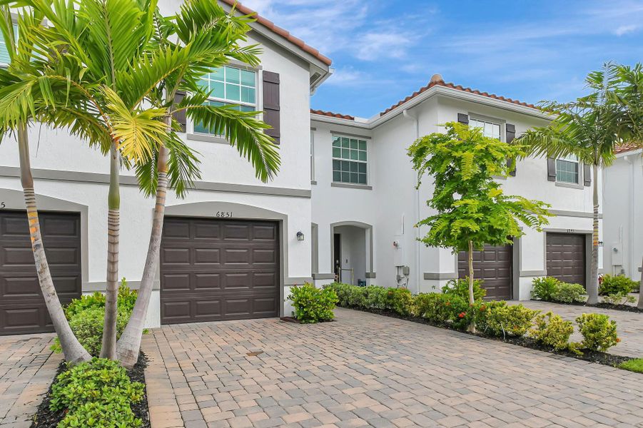 Front exterior of a new home in , Lake Worth, FL, highlighting curb appeal (Image 15).