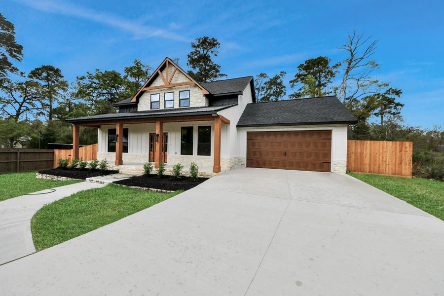 Front exterior of a new home in , Spring, TX, highlighting curb appeal (Image 19).