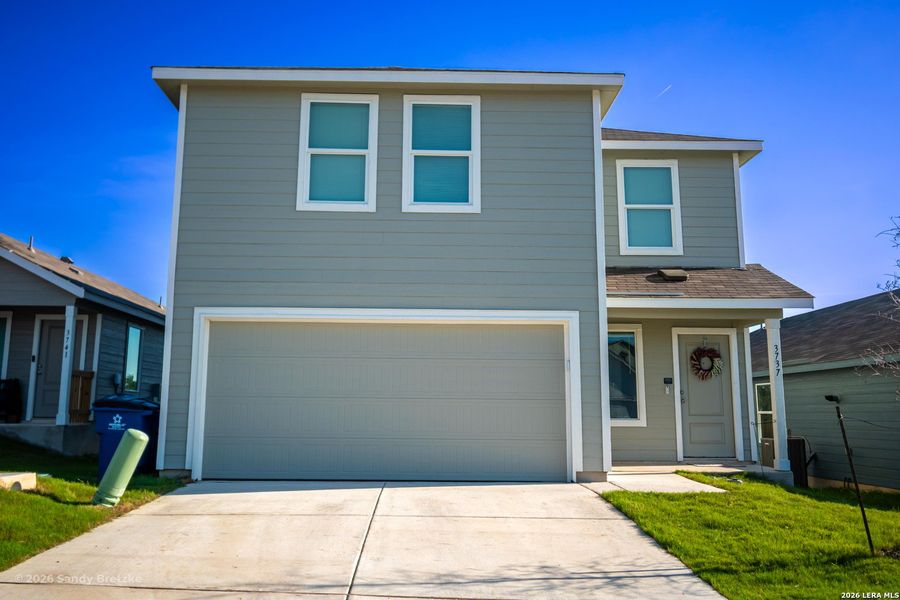 Front exterior of a new home in Brookmill, San Antonio, TX, highlighting curb appeal (Image 2).