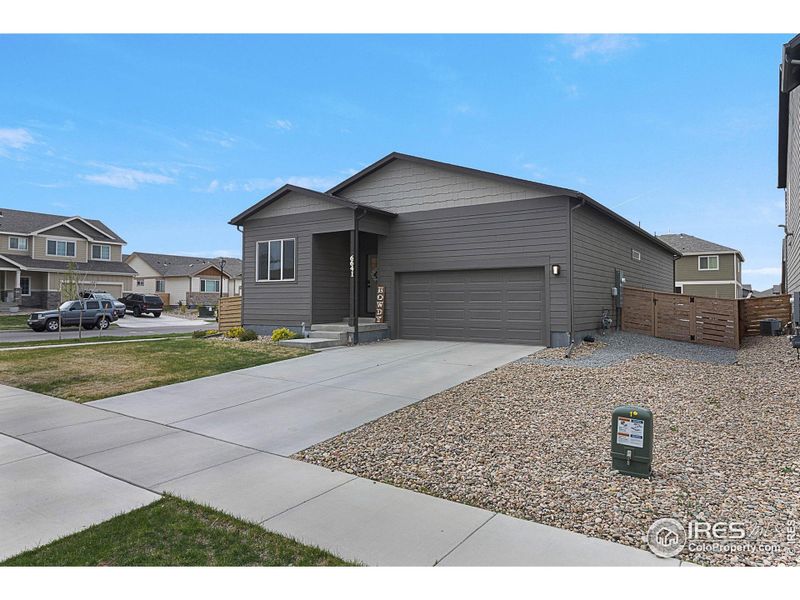 Front exterior of a new home in , Greeley, CO, highlighting curb appeal (Image 18).