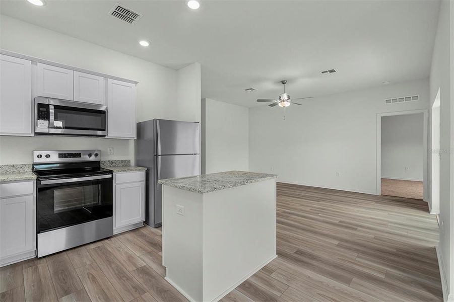 Furnished interior view inside a new home in Tula Parc, Astatula (Image 6).