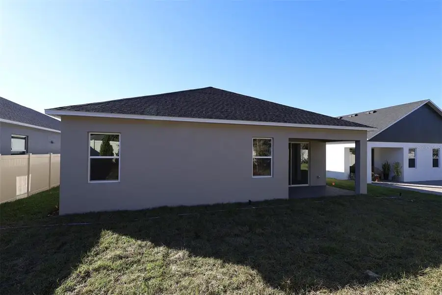 Exterior details and patio area of a home in Emerson Pointe, Apopka (Image 3).