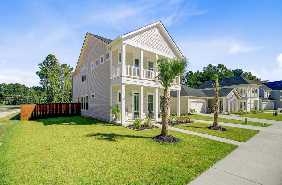 Front exterior of a new home in Limehouse Village: Row Collection, Summerville, SC, highlighting curb appeal (Image 1).