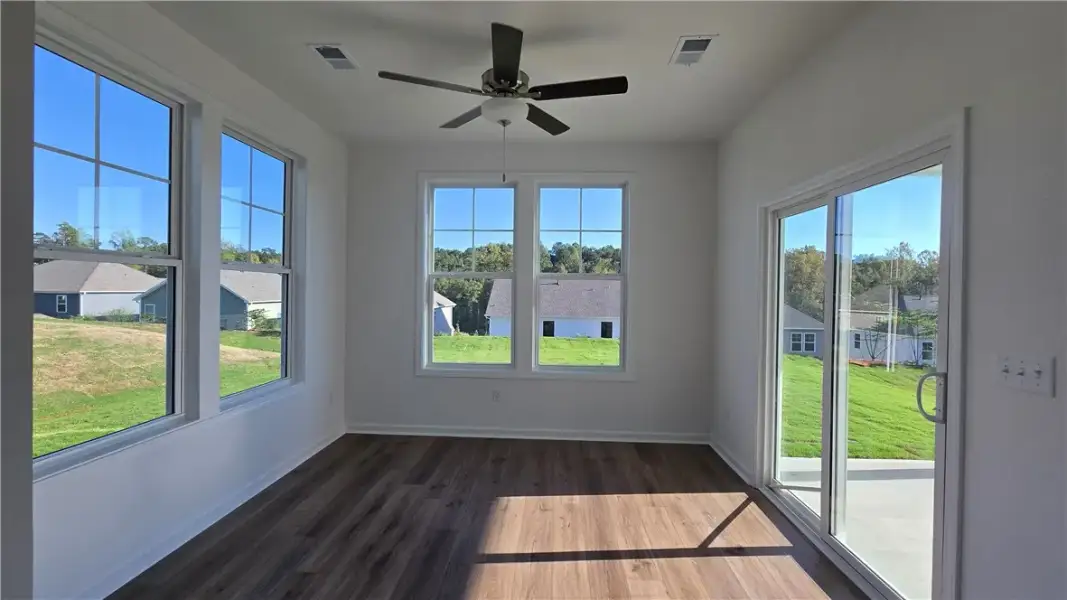 Sunlight streams across the rich wood floors of th