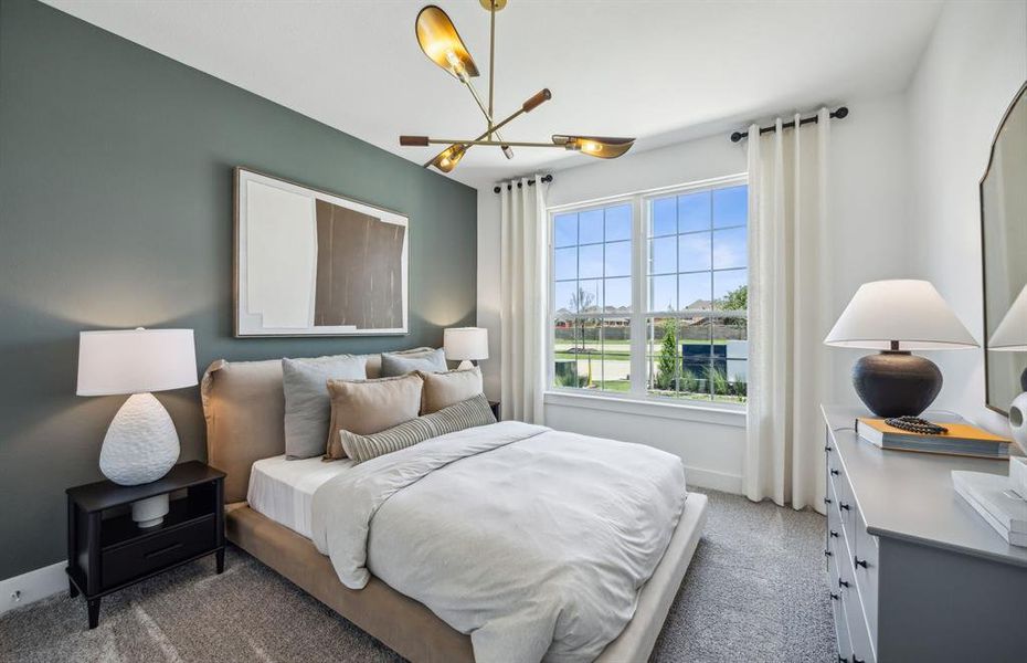 Spacious secondary bedroom with large windows *Model Representation*