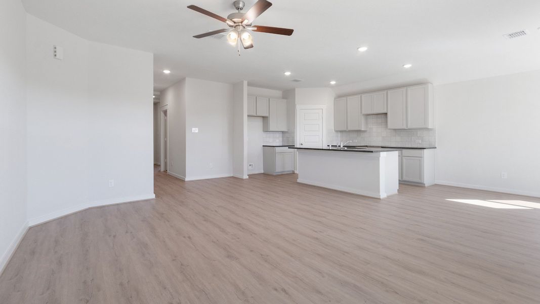 Representative furnished interior of a home built from the Blanton by Brightland Homes in Sunterra, Katy (Image 7).
