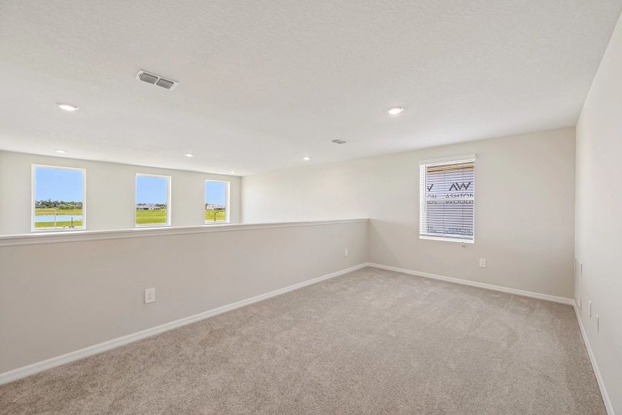At the top of the stairs you will find a spacious loft which looks out on to the great room