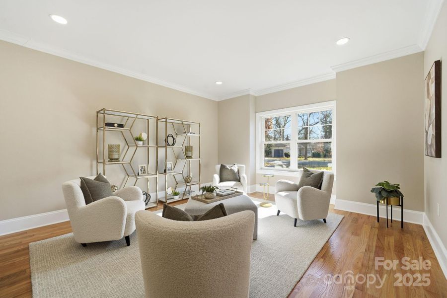 ? Another angle of the front lounge showcasing the elegant layout and sunny window views. ? Another angle of the front lounge showcasing the elegant layout and sunny window views.