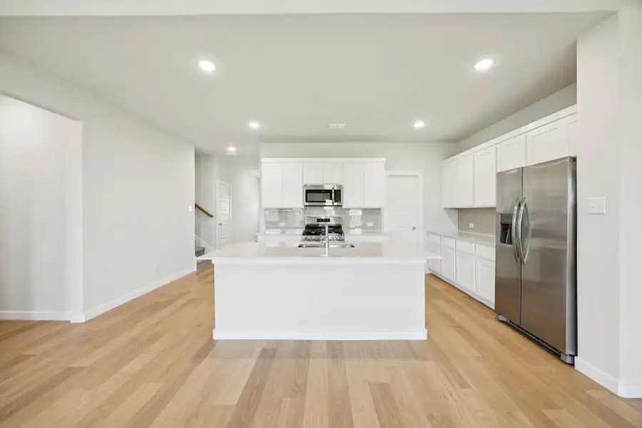 Kitchen in the Masters home plan by Trophy Signature Homes – REPRESENTATIVE PHOTO Kitchen in the Masters home plan by Trophy Signature Homes – REPRESENTATIVE PHOTO