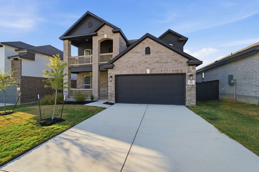 Front exterior of a new home in The Woodlands at Medina Hills, Mico, TX, highlighting curb appeal (Image 22). Front exterior of a new home in The Woodlands at Medina Hills, Mico, TX, highlighting curb appeal (Image 22).