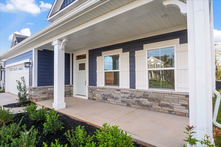 Exterior details and patio area of a home in Canterbrook Farms 2-Story, Fountain Inn (Image 3).