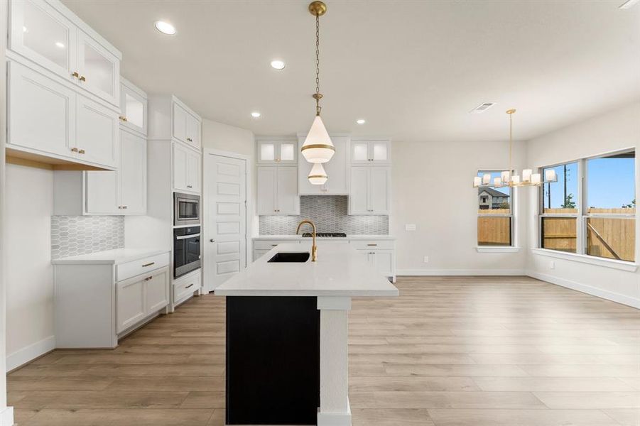 Gold Fixtures, Cabinets to the Ceiling, and Gas Cooktop!