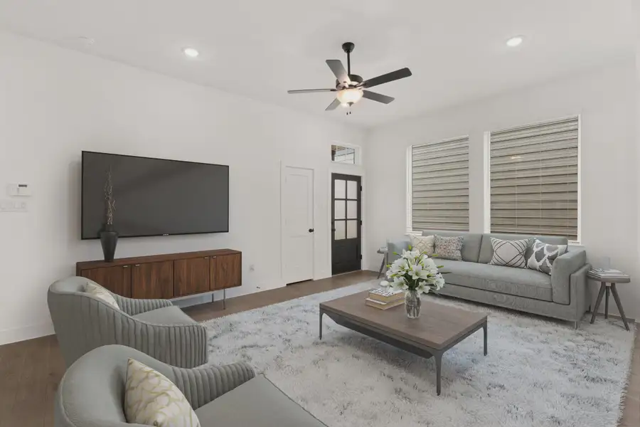 Representative furnished interior of a home built from the Cheverny by Chesmar Homes in The Woodland Hills Chateau, Willis (Image 5).