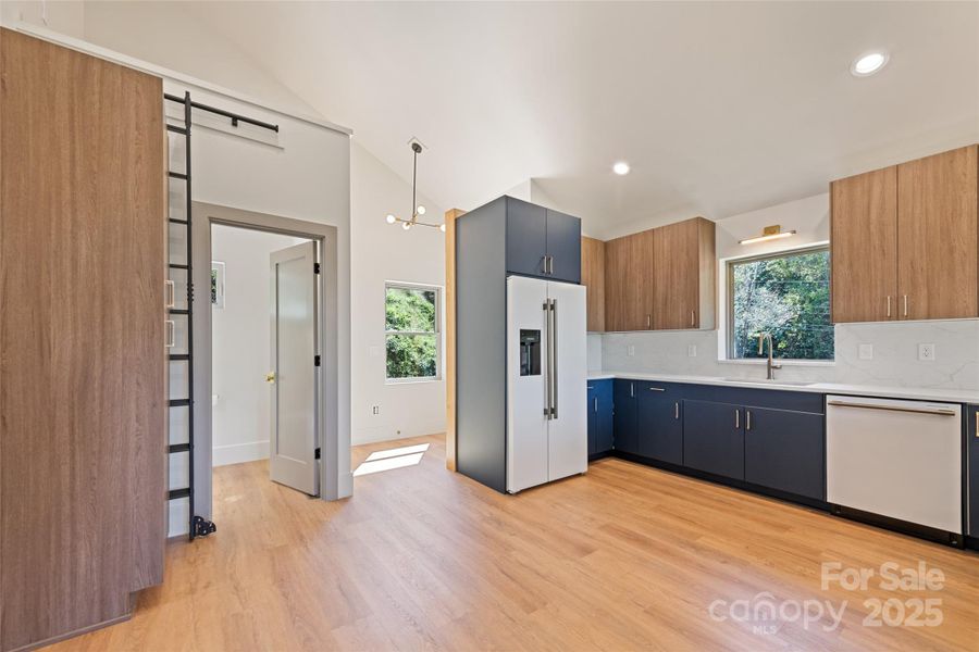 Entry leads directly into open concept kitchen and great room with half bath and micro-loft