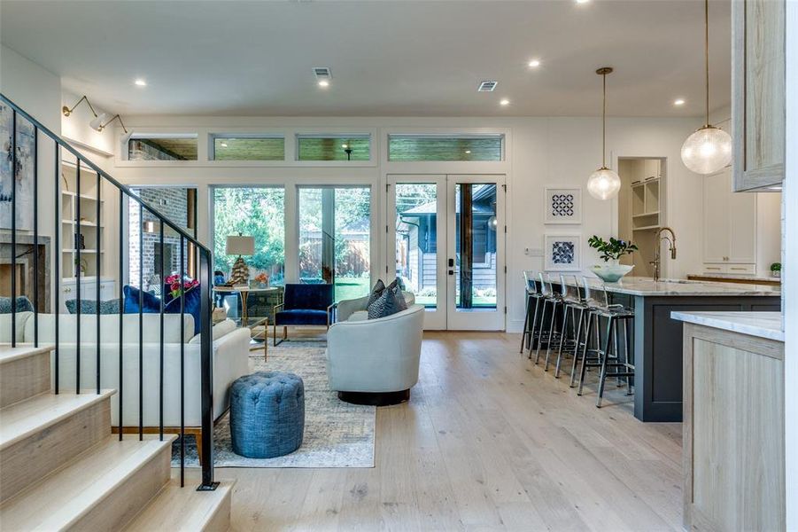 custom steel stair railing. Open living - eat in kitchen