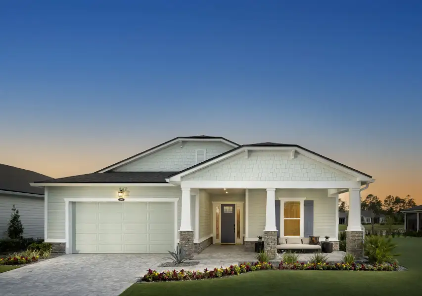 Front exterior of a new home in RiverTown, St. Johns, FL, highlighting curb appeal (Image 18). Front exterior of a new home in RiverTown, St. Johns, FL, highlighting curb appeal (Image 18).