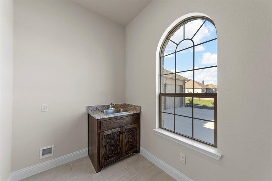 Bathroom featuring plenty of natural light and sink