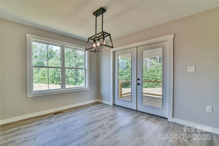 Diniing Room with French Doors to Covered Back Porch.