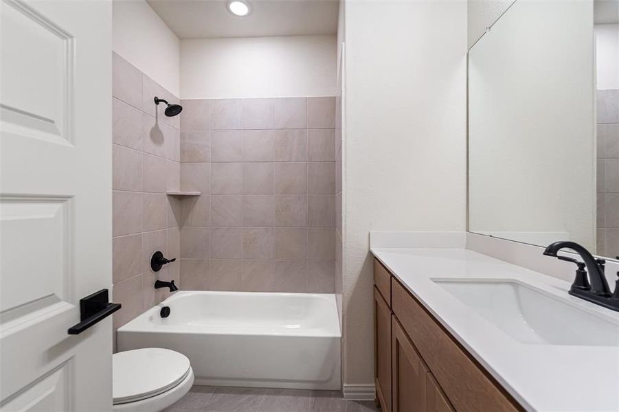 Bathroom with shower / tub combination and vanity