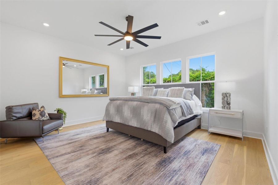 Just off the main living areas, the first-floor primary suite offers a highly sought-after layout that is hard to find.