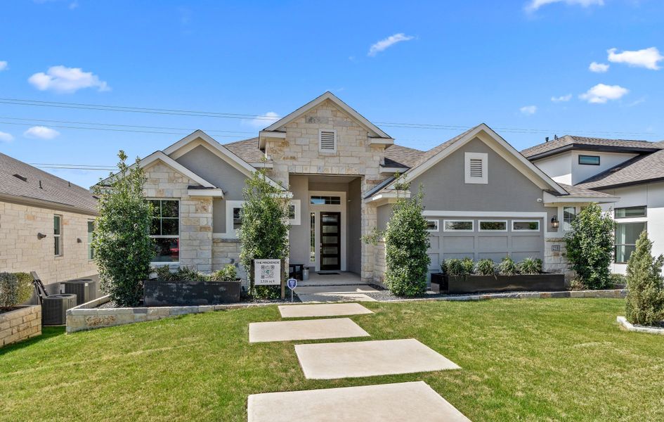 Front exterior of a new home in Esperanza – New Phase Now Selling, Boerne, TX, highlighting curb appeal (Image 2). Front exterior of a new home in Esperanza – New Phase Now Selling, Boerne, TX, highlighting curb appeal (Image 2).