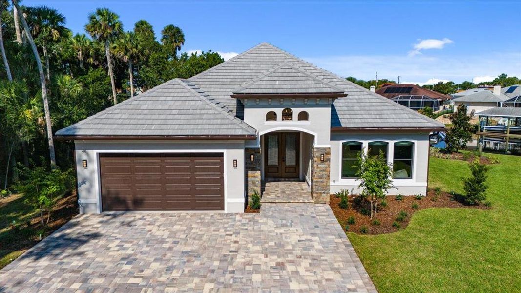 Front exterior of a new home in , Palm Coast, FL, highlighting curb appeal (Image 26).