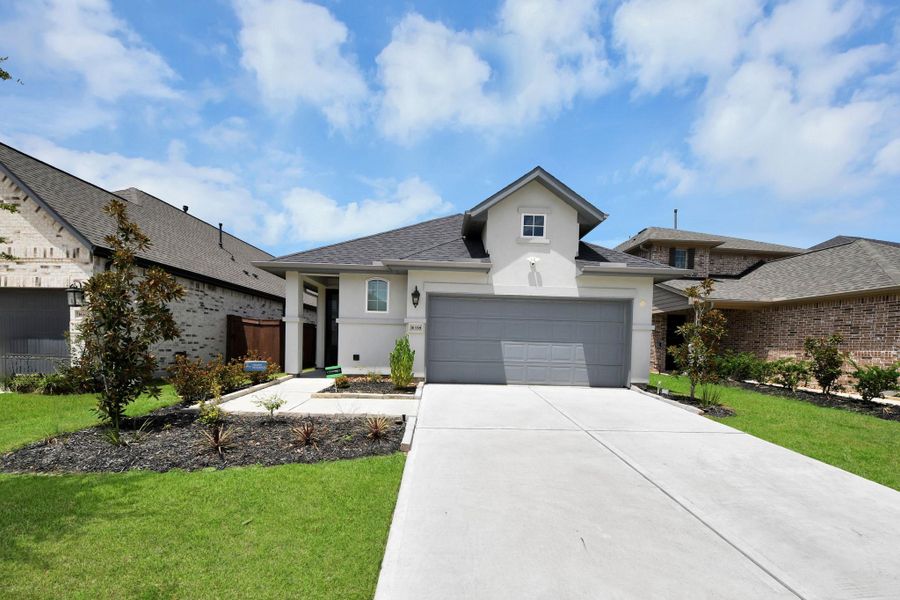 Front exterior of a new home in , Conroe, TX, highlighting curb appeal (Image 24).