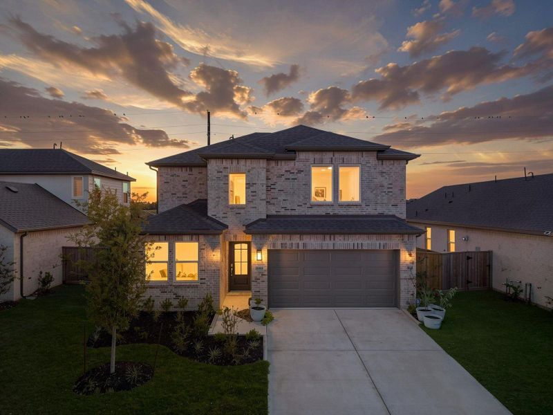 The front exterior introduces a 2025 Taylor Morrison home with a clean modern elevation, stone accents, and warm evening light. The double-wide driveway and attached garage create a polished first impression in Bridge Creek. Virtually enhanced. The front exterior introduces a 2025 Taylor Morrison home with a clean modern elevation, stone accents, and warm evening light. The double-wide driveway and attached garage create a polished first impression in Bridge Creek. Virtually enhanced.