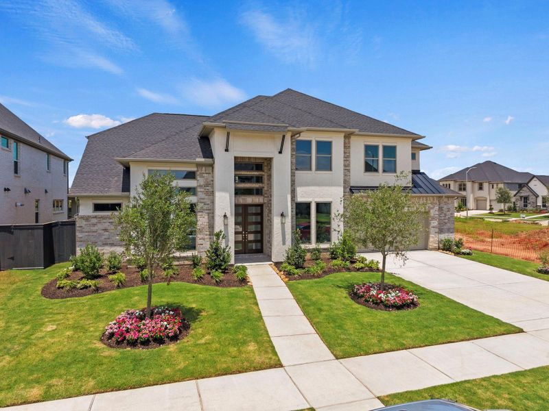 Front exterior of a new home in Harvest Green, Richmond, TX, highlighting curb appeal (Image 21). Front exterior of a new home in Harvest Green, Richmond, TX, highlighting curb appeal (Image 21).