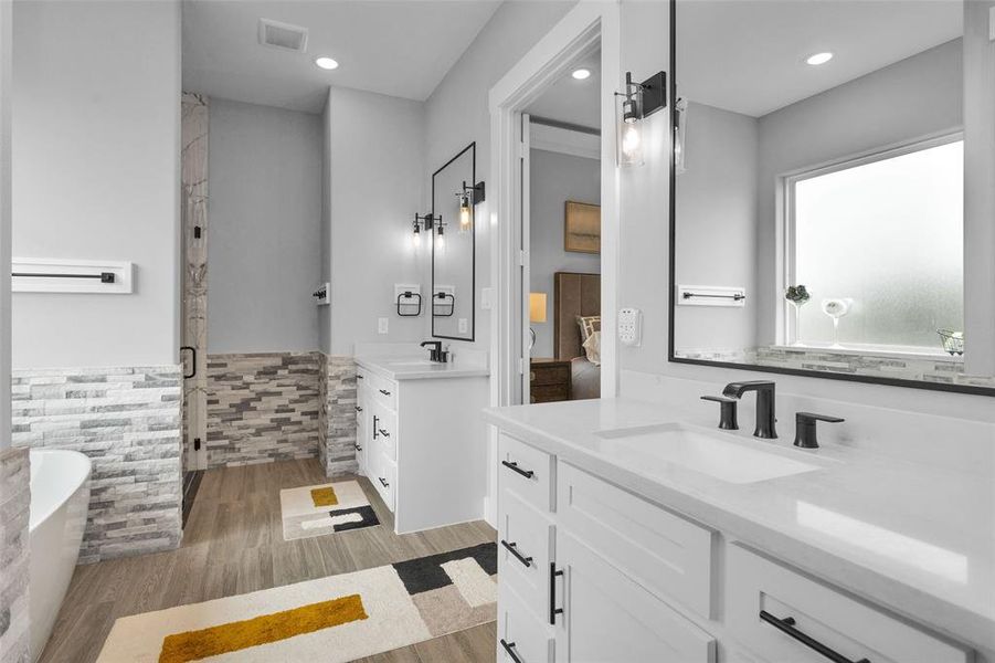 Separate vanities and space to move also in primary bath.