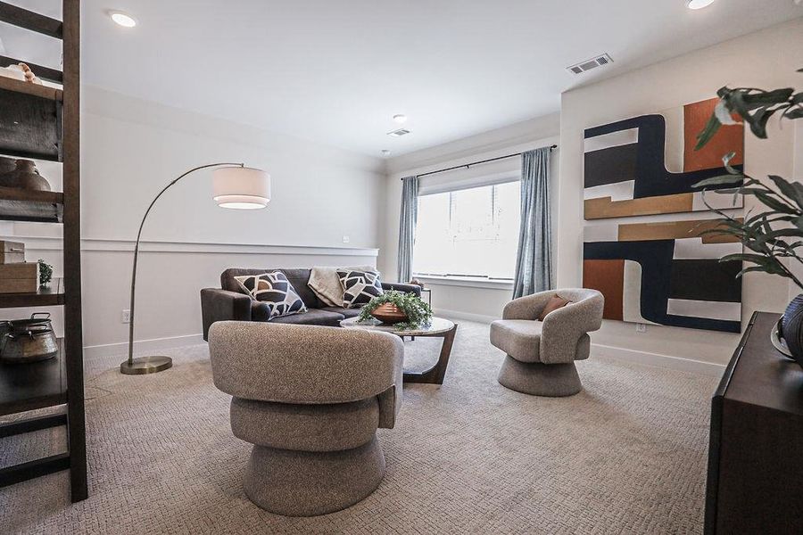Living area featuring carpet and recessed lighting