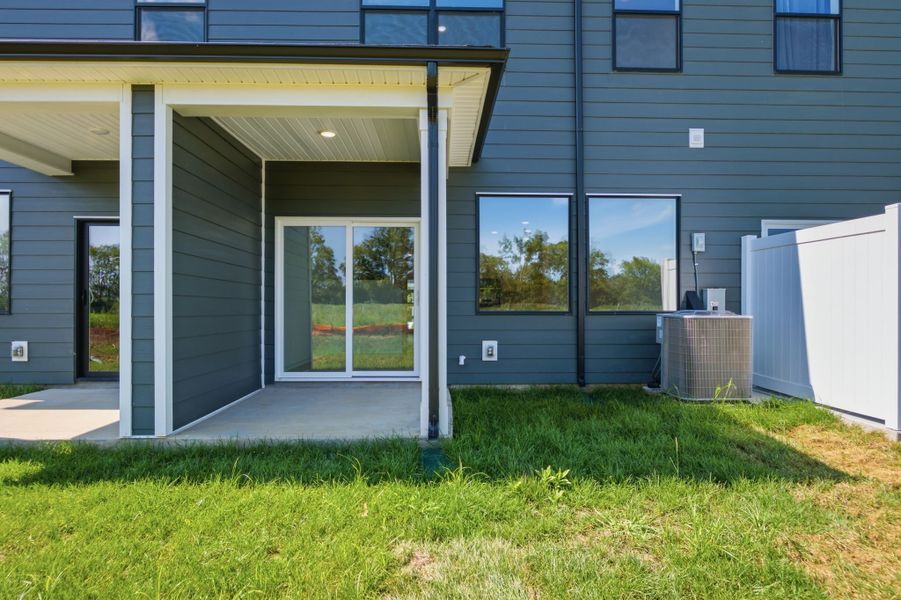 Exterior details and patio area of a home in Nexus Townhomes, Gallatin (Image 3).