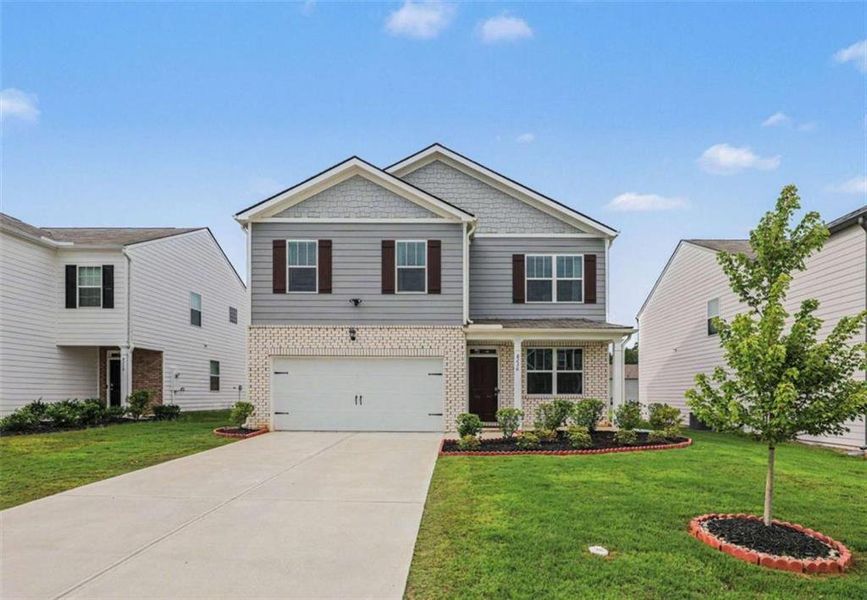 Front exterior of a new home in , Fairburn, GA, highlighting curb appeal (Image 26). Front exterior of a new home in , Fairburn, GA, highlighting curb appeal (Image 26).