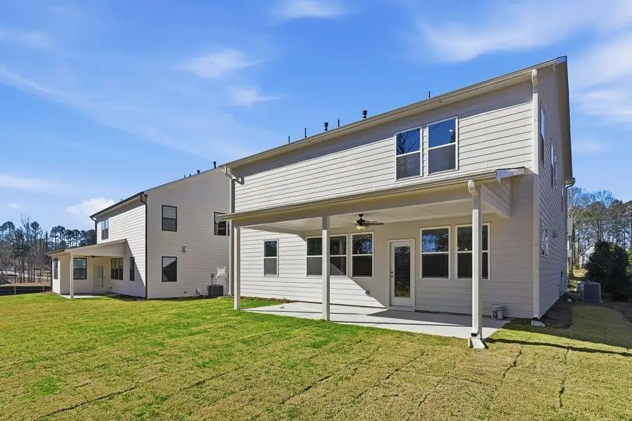 Exterior details and patio area of a home in Reserve at Hickory Walk, Kennesaw (Image 4).