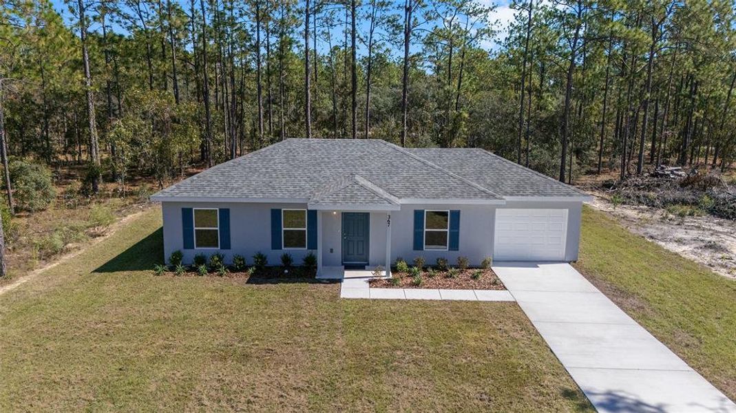 Front exterior of a new home in , Dunnellon, FL, highlighting curb appeal (Image 26). Front exterior of a new home in , Dunnellon, FL, highlighting curb appeal (Image 26).