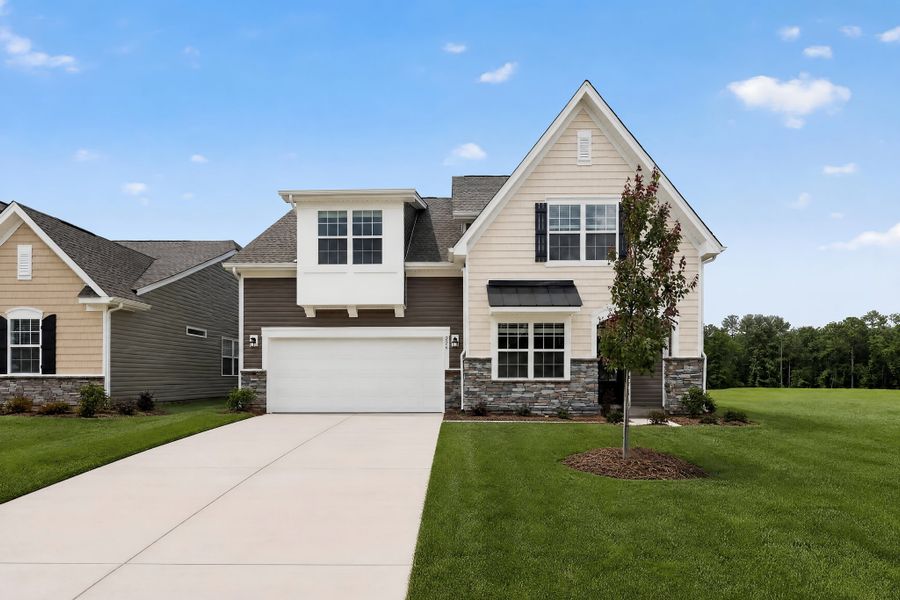 Front exterior of a new home in Pine Oaks Estates, Gilbert, SC, highlighting curb appeal (Image 1). Front exterior of a new home in Pine Oaks Estates, Gilbert, SC, highlighting curb appeal (Image 1).