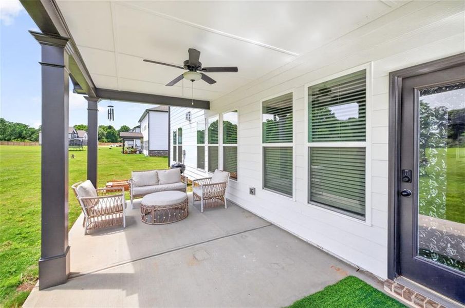 Exterior details and patio area of a home in Porches at Mobley Lake, Dacula (Image 3).